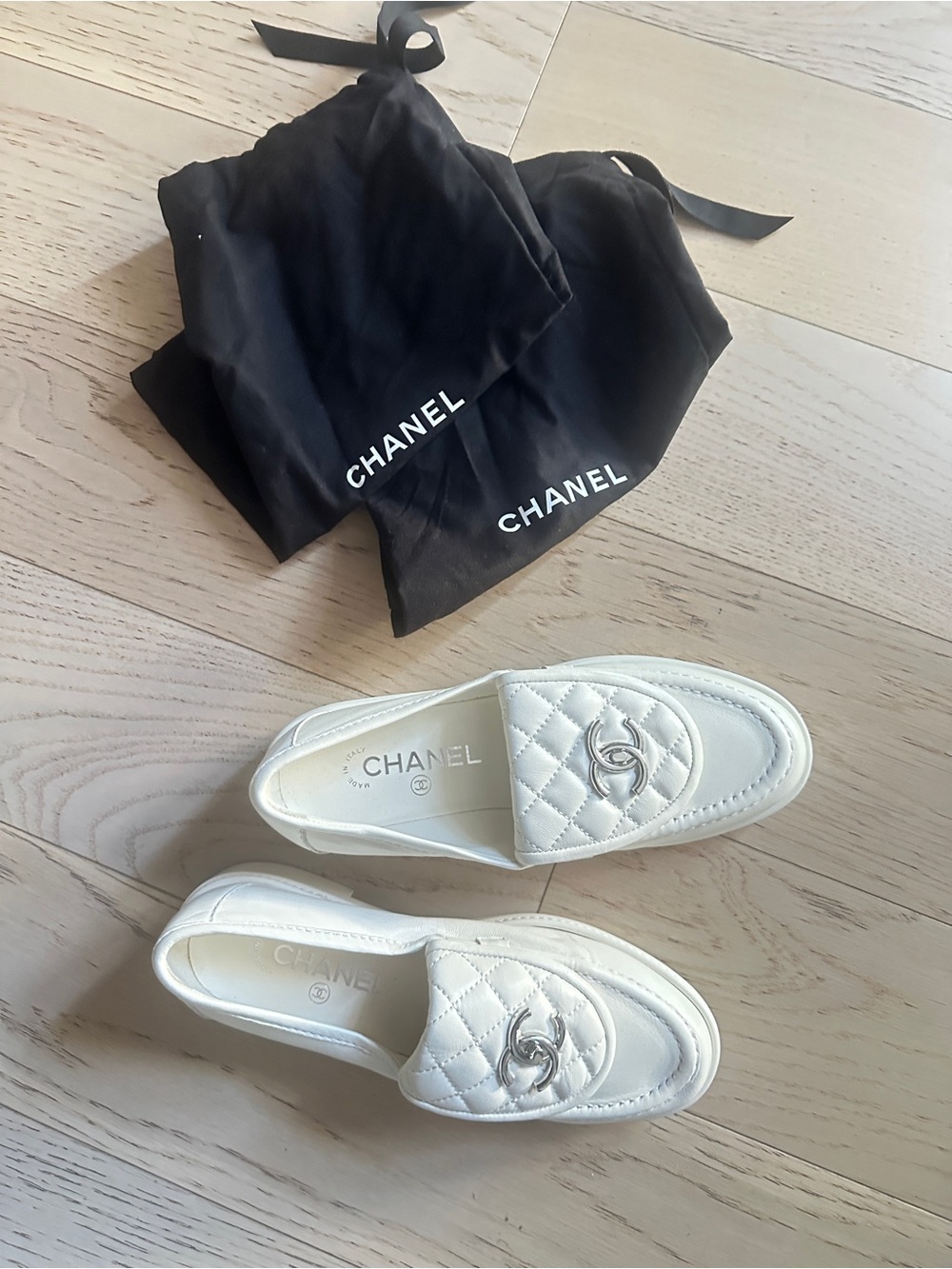 CHANEL White Quilted Leather Loafers with Silver CC Hardware